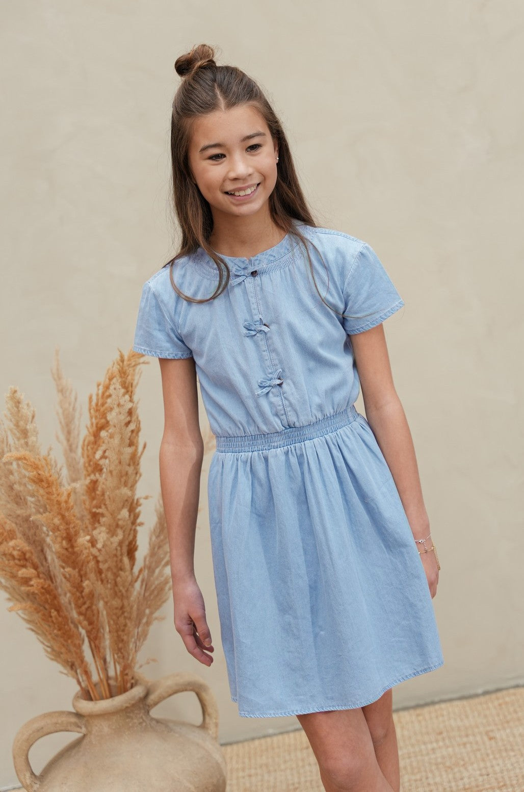 Mel Flo girls chambrey dress with bow closure at CF