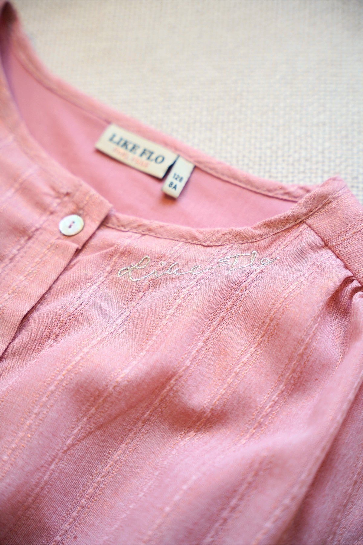 Maika Flo girls glitter dress with knot and button closure at front