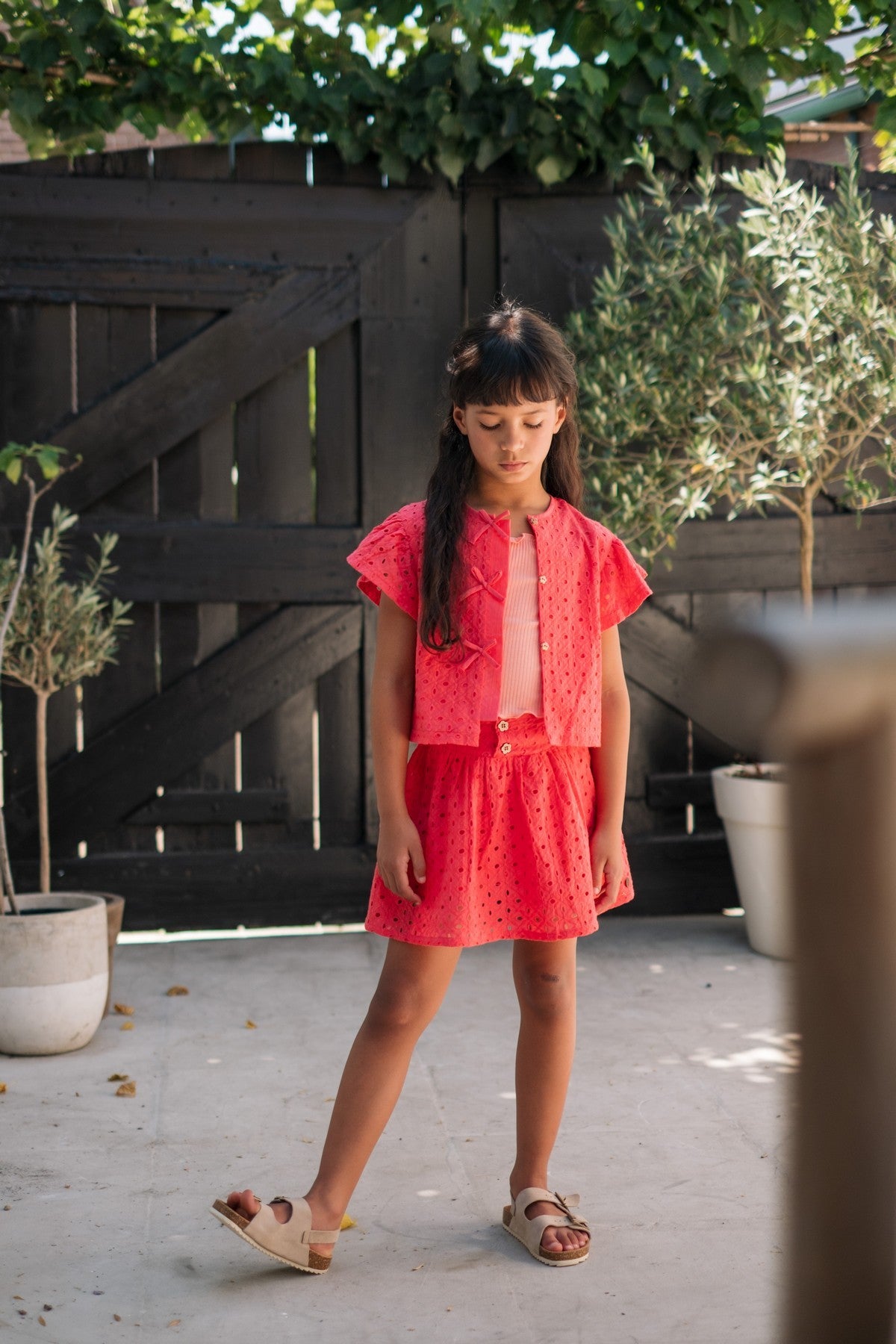 Charlotte Flo girls broderie anglaise blouse with fake bow closure