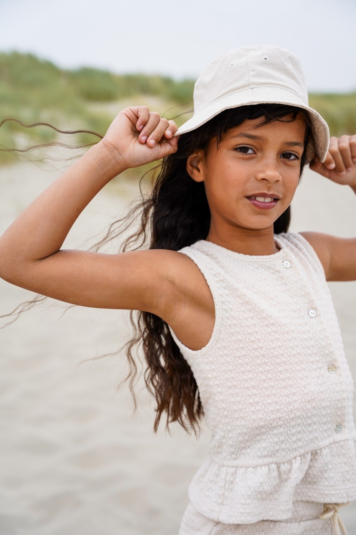 Eleah Flo girls knitted peplum top with button closure